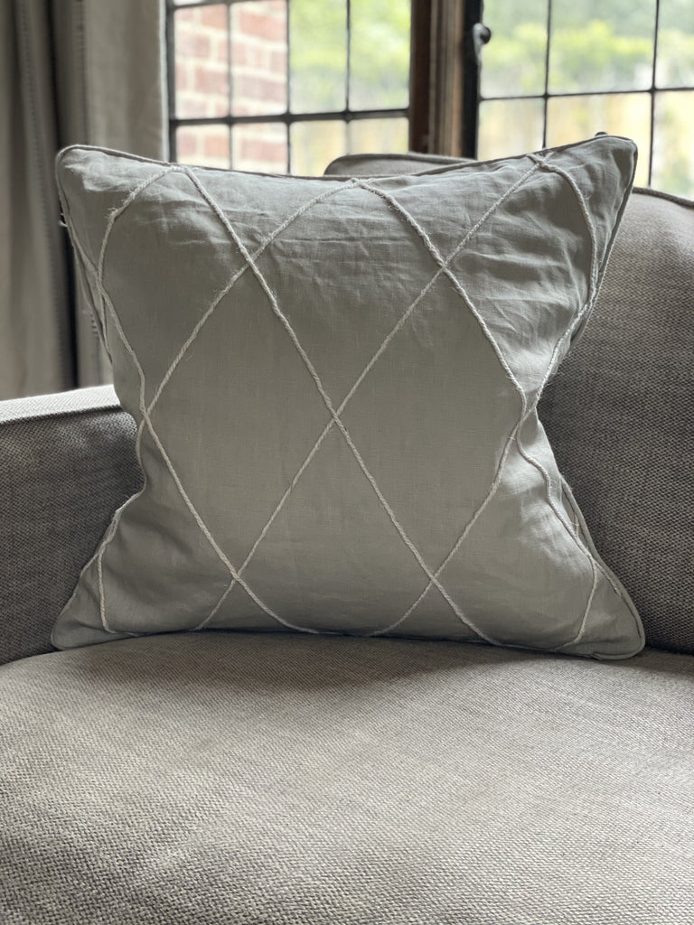 grey cushion with white diagonal stripes