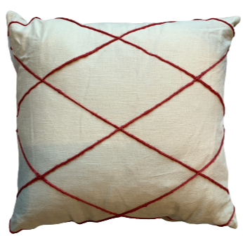 white cushion with red diagonal stripes